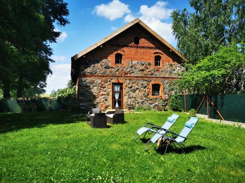 Foto de la galería de Mazurski Ogród - dom z ogrodem, kominkiem i wiatą biesiadną en Wydminy