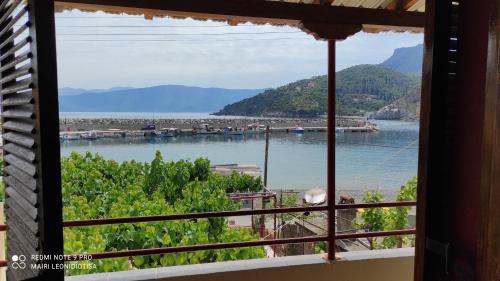 a view of a river from a window at Porto Sabatiki in Sampatiki