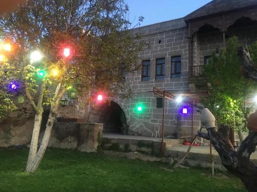 a group of street lights in front of a building at Kapadokya Ihlara Günalp Konağı in Guzelyurt