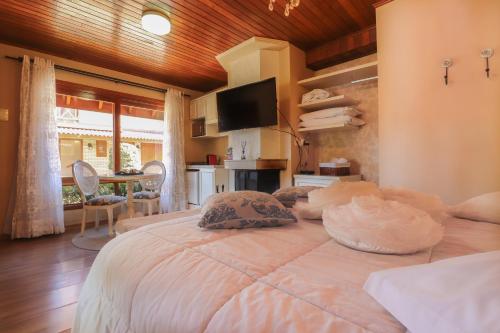 Ένα ή περισσότερα κρεβάτια σε δωμάτιο στο Cabanas Belo Destino