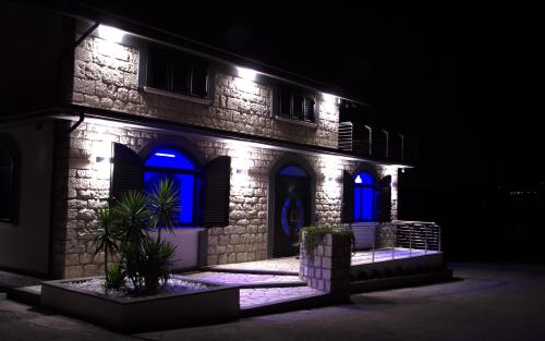 a house with blue lights on the side of it at La Cartolina del Sannio in Campolattaro