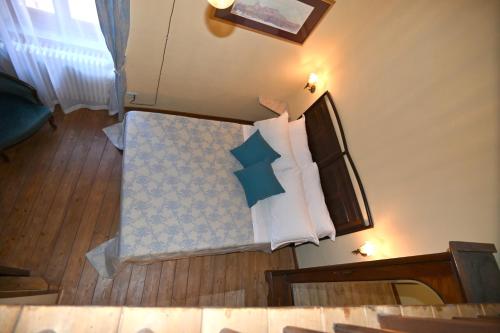 a room with a bed with pillows on it at il Cantuccio in Pitigliano