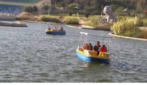 two boats in a river with people on them at מדבריות השחר in Dimona
