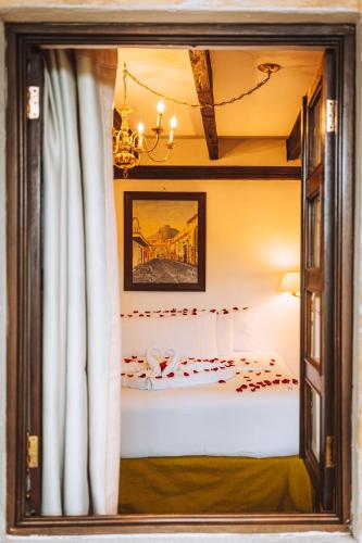 Ένα ή περισσότερα κρεβάτια σε δωμάτιο στο El Carmen Hotel