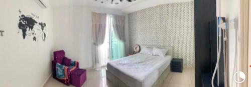 a small bedroom with a bed and a window at Mansion One Seaview Luxury 2 Bedroom Gurney Georgetown gleneagles in George Town