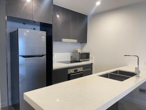 Kuchyň nebo kuchyňský kout v ubytování Serenity Surfers Paradise