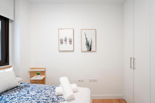 A bed or beds in a room at Plaza Nueva HOMES