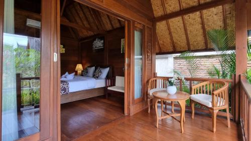 Postel nebo postele na pokoji v ubytování Cersen Resort Lombok