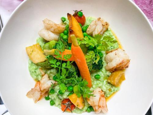 a white plate of food with shrimp and vegetables at Auberge Le Relais in Chavannes-de-Bogis