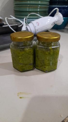 two jars of pickles on a counter with a wii controller at Blu oceano B&B, Italian restaurant in Nembrala