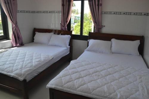 Ένα ή περισσότερα κρεβάτια σε δωμάτιο στο Thanh Duy Guest House