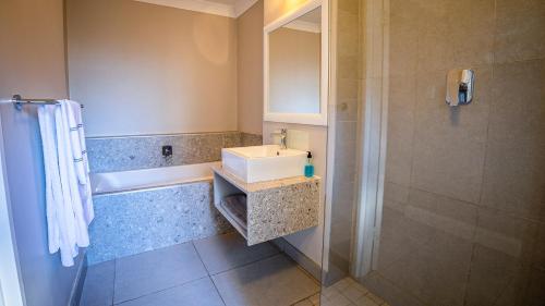 A bathroom at Modern self-catering apartment in a secure estate