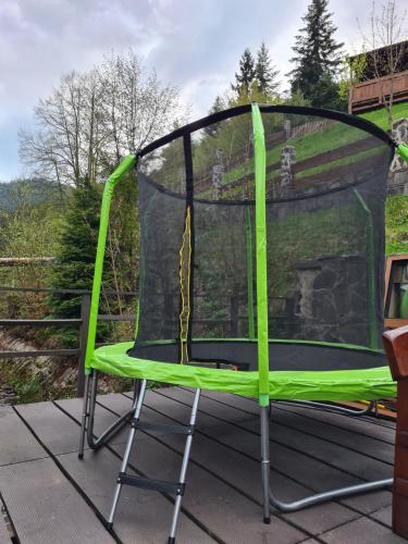 a trampoline with a net on a deck at Pension St. Maria in Staré Hory