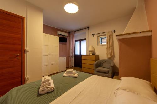Postel nebo postele na pokoji v ubytování Agriturismo Santo Stefano