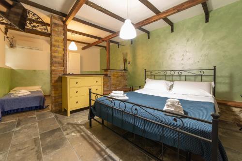 Postel nebo postele na pokoji v ubytování Agriturismo Santo Stefano