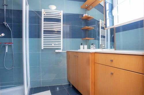 a bathroom with a sink and a shower at Terrace Bairro Novo by Rent4All in Figueira da Foz