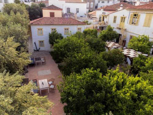 an overhead view of a garden with trees and buildings at Rafalias Mansion in Hydra