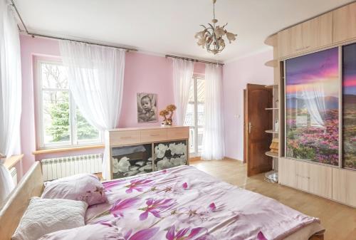 Posteľ alebo postele v izbe v ubytovaní Apartament Mazurek