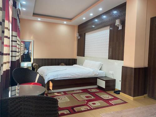 מיטה או מיטות בחדר ב-Hotel Gorkha Palace Pvt. Ltd