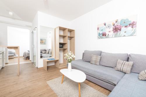 a living room with a couch and a table at Stella Mare Eco Boutique House in Zavala