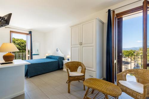 Postel nebo postele na pokoji v ubytování Hotel Agugliastra