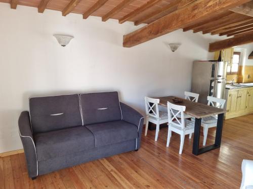 a living room with a couch and a table at Podere Vecci in Dicomano