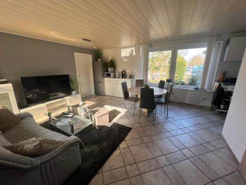 a living room with a couch and a table at Achtern Diek in Lembruch