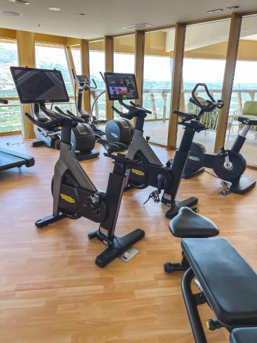 a gym with a bunch of exercise bikes in a room at IntempoCarrera - Apartment at Intempo Building in Benidorm