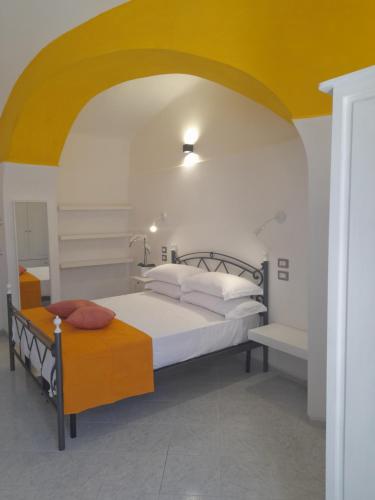 Postel nebo postele na pokoji v ubytování Mezza Torre B&B