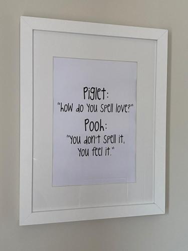 a framed picture of a poem on a wall at The Piggery at the Cottage in Wool