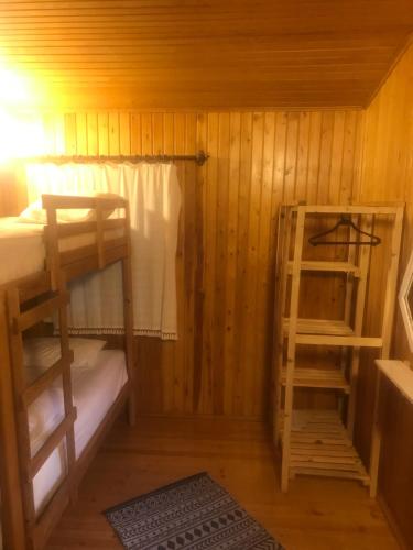 a small room with two bunk beds in a cabin at Kibala Hotel in Cıralı