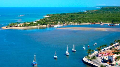 an aerial view of a harbor with boats in the water at Paraíso Casa Branca in Arraial d'Ajuda