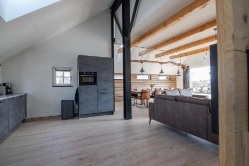 a living room with a couch and a table at erve Middendorp in Ansen