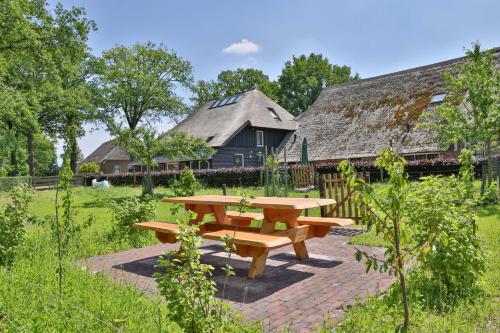 a picnic table in the yard of a house at erve Middendorp in Ansen