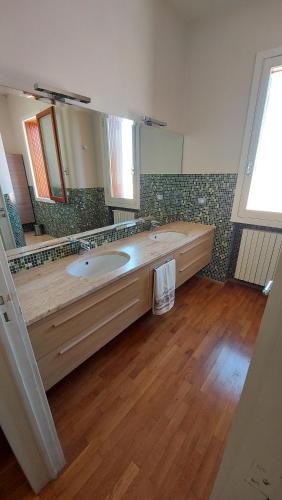Ванна кімната в Le Strelizie