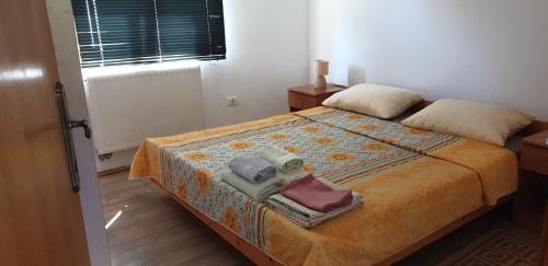 Posteľ alebo postele v izbe v ubytovaní Apartments Nena 3*