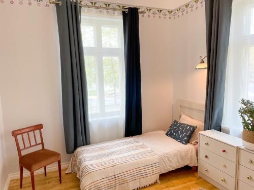 Postel nebo postele na pokoji v ubytování Spacious Supeluse Apartment