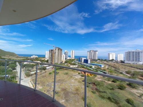 a view of the city from the balcony of a building at Terrazas Tayrona Travelers Apartamentos y Suites in Santa Marta