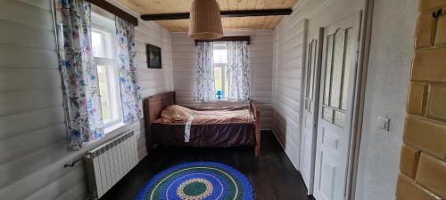 En eller flere senge i et værelse på Filipówka