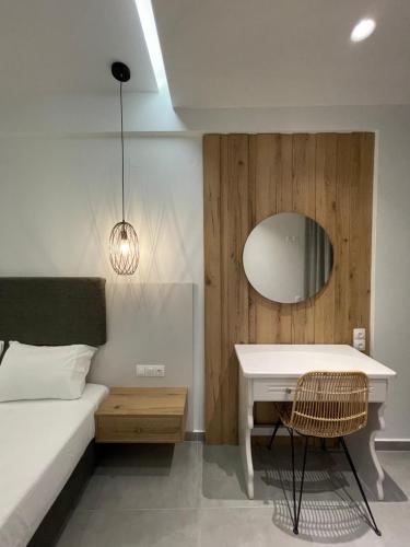 Ένα ή περισσότερα κρεβάτια σε δωμάτιο στο George Deluxe Apartments