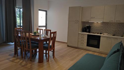 a kitchen and dining room with a table and chairs at Soula Apartments & Studios in Palaiochora