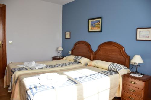 En eller flere senge i et værelse på CASA RAICHU