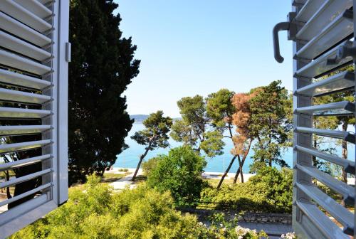 a view of the beach from a house at Apartman Nikki Kolovare Beach in Zadar