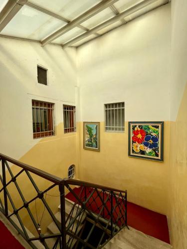 a staircase in a building with two pictures on the wall at Ai Boteri in Venice