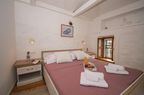 a large bedroom with two beds and a table at Kaleta in Vodice