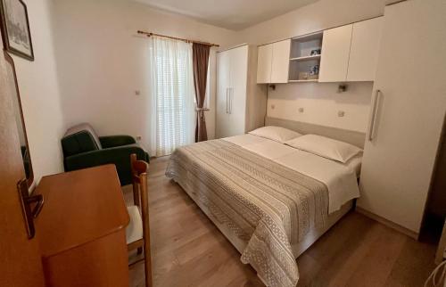 Postel nebo postele na pokoji v ubytování Apartments Villa Emilija