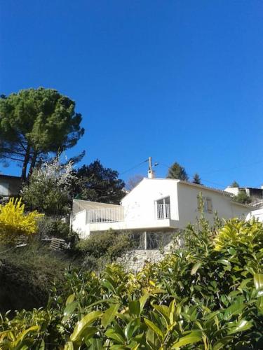 a white house sitting on top of a hill at Provence Forcalquier Gîte du Paradis in Forcalquier