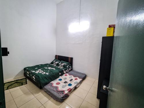 Katil atau katil-katil dalam bilik di Q&R Homestay Residence