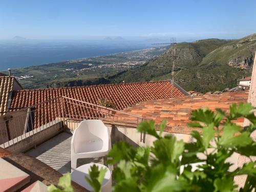 a white chair sitting on top of a roof at Bed & Breakfast StudioArcodia- in San Marco dʼAlunzio