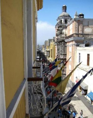 a view of a balcony with flags on a street at Hotel Inka Path in Lima